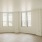 Living spaces with natural lighting and wood-like flooring