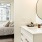 Spacious and well lit bedroom with plush carpet and large windows