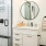 Large well lit bathroom with designer tile floors and a large walk- in shower 